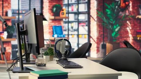 Digital workstation features multiple PC monitors running artificial Stock Photos