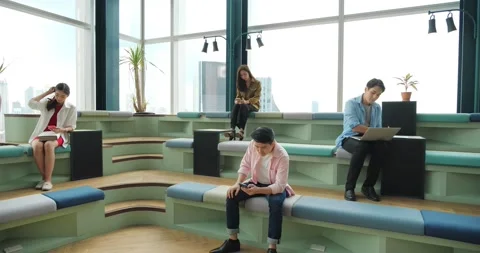 Digital world. Groups of young Asian people holding digital devices sitting Stock-Footage 169558068