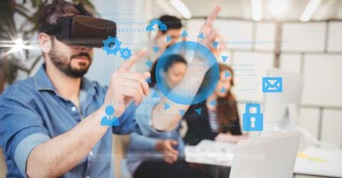 Digitally generated image of businessman touching icons while using VR glasses Stock Photos