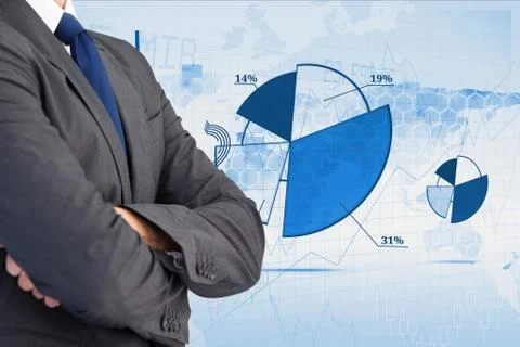 Digitally generated image of businessman with various charts in background Stock Photos