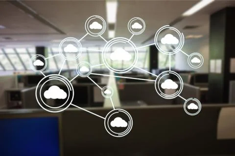 Digitally generated image of cloud computing icons in office Stock Photos