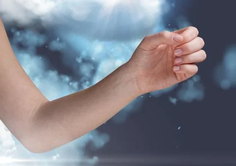 Digitally generated image of hand againt cloud Foto stock