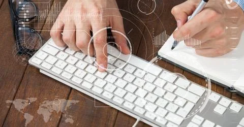 Digitally generated image of hands using computer keyboard while writing Stock Photos