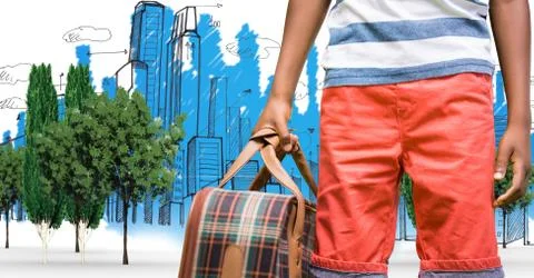 Digitally generated image of man holding bag while standing with buildings drawn Fotos de archivo