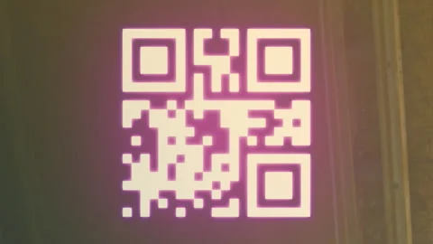 A digitally generated image of a qr code with neon elements flashing on a black Stock Footage 312394542