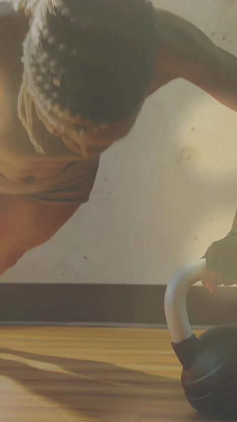 Digitally generated video of glowing spots against woman performing push ups in Stock Footage 342801856