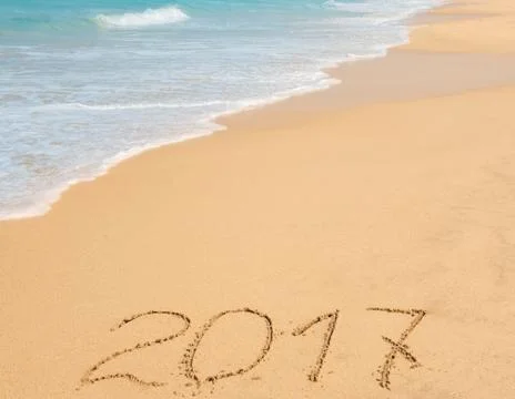 Digits  2017 on the sand Stock Photos