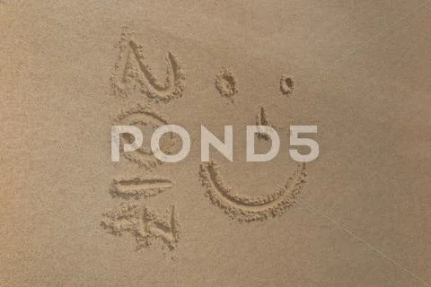 Digits 2017 on the sand seashore - concept of new year Stock Photos