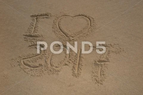 Digits 2017 on the sand seashore - concept of new year Stock Photos