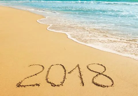 Digits  2018 on the sand Stock Photos