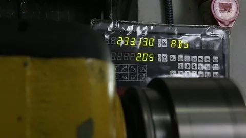 Digits on a tablet of lathe are being counted while machine working Stock Footage 125748083