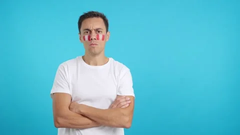 Dignified and serious man with peruvian flag painted on face Stock Footage 255546401