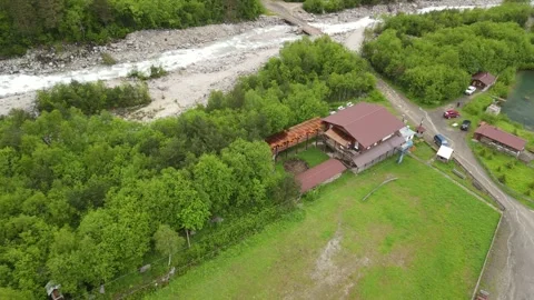 DIGORA GORGE, NORTH OSSETIA - JUNE 1, 2024: Aerial view of mountain cafe Stock Footage 337462708
