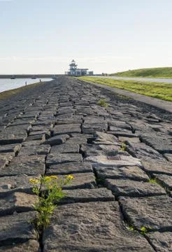 Dike and old lighthouse at Leith harbour, Edinburgh, Scotland Stock Photos