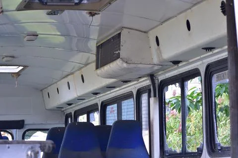 Dilapidated and rusty bus with broken windows in a remote area. Scrap. Stock Photos