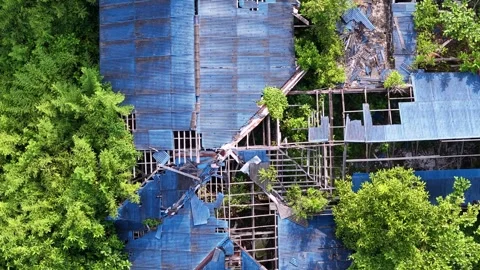 Dilapidated blue structure captured from above Video stock 346254970