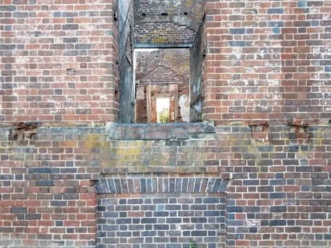 Dilapidated brick house or structure in ruins Stock Photos