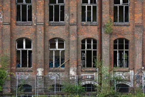 Dilapidated facade with graffiti Stock Photos