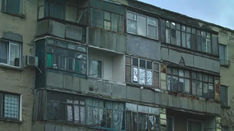 Dilapidated Facade of a Soviet-Era Apartment Building Stock Footage 313696448