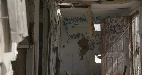 Dilapidated House Interior Front Room and Graffiti - Tilt Down Stock Footage 89941960
