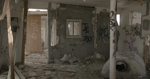 Dilapidated House Interior Front Room and Graffiti and Exterior Wall - Pan Left Stock Footage 89941978