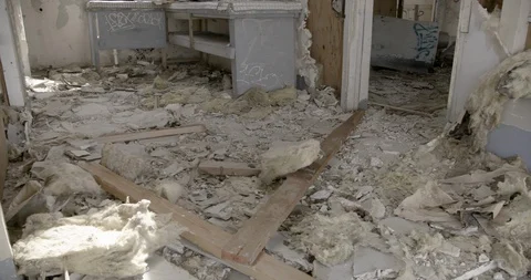 Dilapidated House Interior Kitchen Floor  - Pan Left to Right Stock Footage 89941940