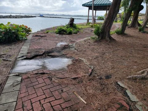 Dilapidated or broken red brick path or trail Stock Photos