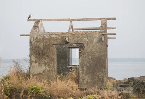 Dilapidated structure by the sea shore Stock Photos