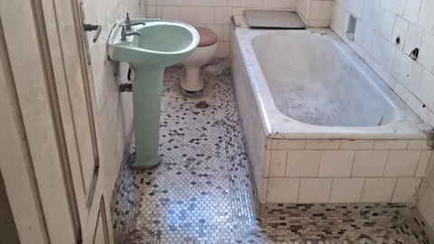 Dilapidated vintage bathroom interior features antique mosaic floor motion video Stock Footage 339248174