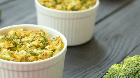 Dilicious dinner - baked broccoli and cheese in ceramic Stock Footage 68202051