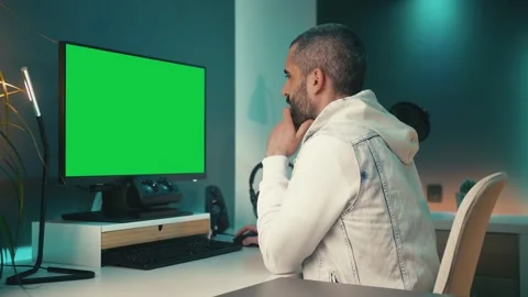 Diligent bearded man works on computer in funky home office studio. He Stock Footage 241765285