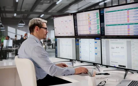 Diligent Bookkeeper Analyzes Payroll Information On Computer In A Corporate O Stock Photos