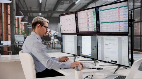 Diligent Bookkeeper Analyzes Payroll Information On Computer In A Corporate O Stock Photos