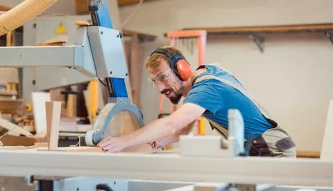 Diligent carpenter with fun at work Stock Photos