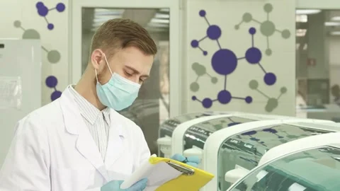 Diligent laboratory assistant meticulously records test results Stock Footage 311944566