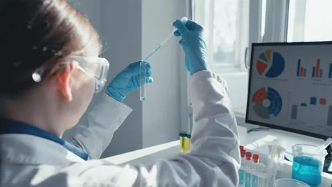 A diligent scientist is conducting a complex experiment in a wellequipped lab Stock Footage 290115656