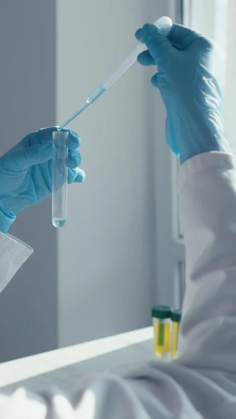 A diligent scientist is conducting a complex experiment in a wellequipped lab Stock-Footage 293206424