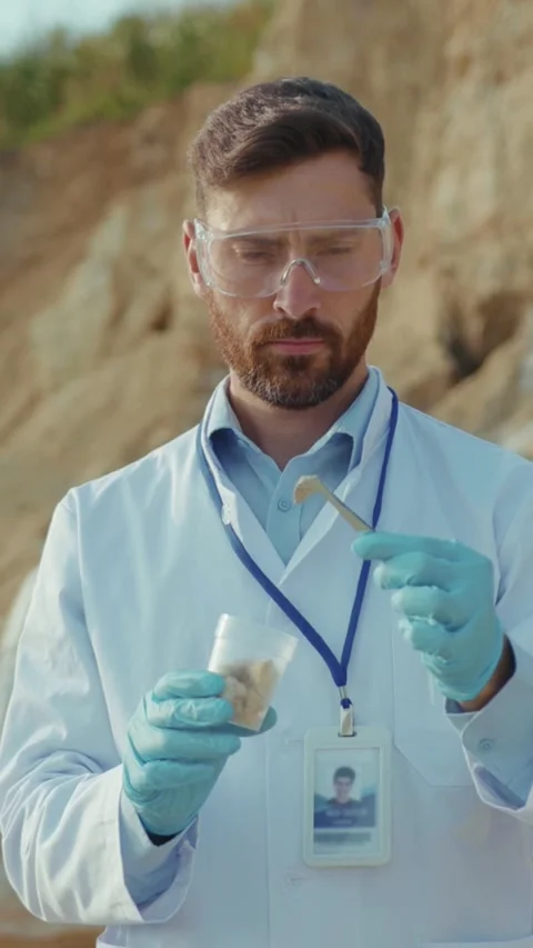 A diligent scientist is meticulously analyzing various samples collected in the Stock Footage 314207472