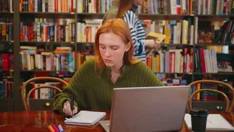 Diligent Student Working on Laptop in Library Stock Footage 265062750