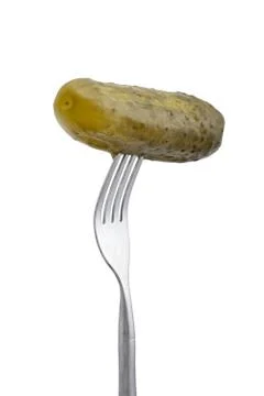 Dill pickle on fork Stock Photos