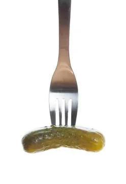 Dill pickle speared Stock Photos