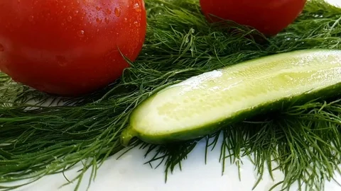 Dill red tomato drops cucumber wet on white background Stock Footage 88352706