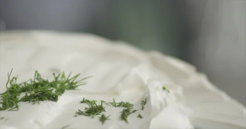 Dill will fall on the cream Stock Footage 199023463