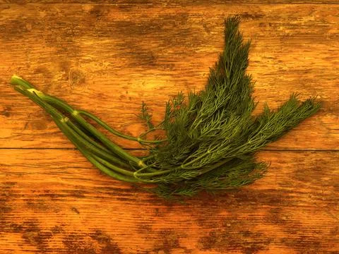 Dill on a wooden table Foto stock