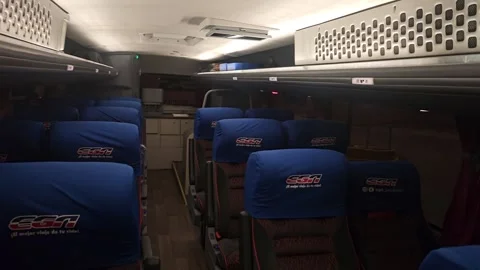 Dim Coach Cabin With Rows Of Blue Seats, Montevideo, Uruguay 8K Stock Footage 306494211