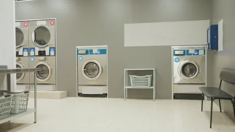Dim Laundry Shop Interior With Washing Machines And Faint Digital Glow Stock Footage 318844904