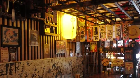 Dim old-style wooden interior design of the Ishiyama Japanese Restaurant Stock Footage 336006747
