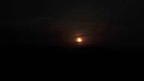 Dim Solar Eclipse Through Heavy Cloud Layers Stock Footage 344441330