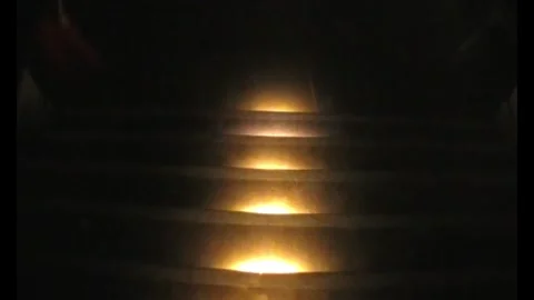 Dim staircase glowing with warm light at night Stock Footage 346147808