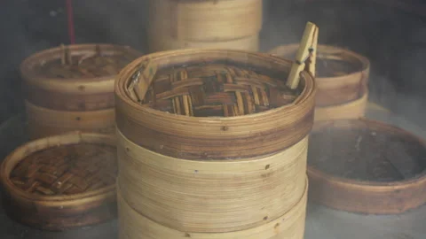 Dim sum bamboo baskets around steamer POV at Chinese restaurant Stock Footage 143787909